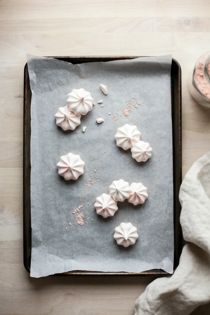 Peppermint meringue snowflake cookies with pink marbled swirls
